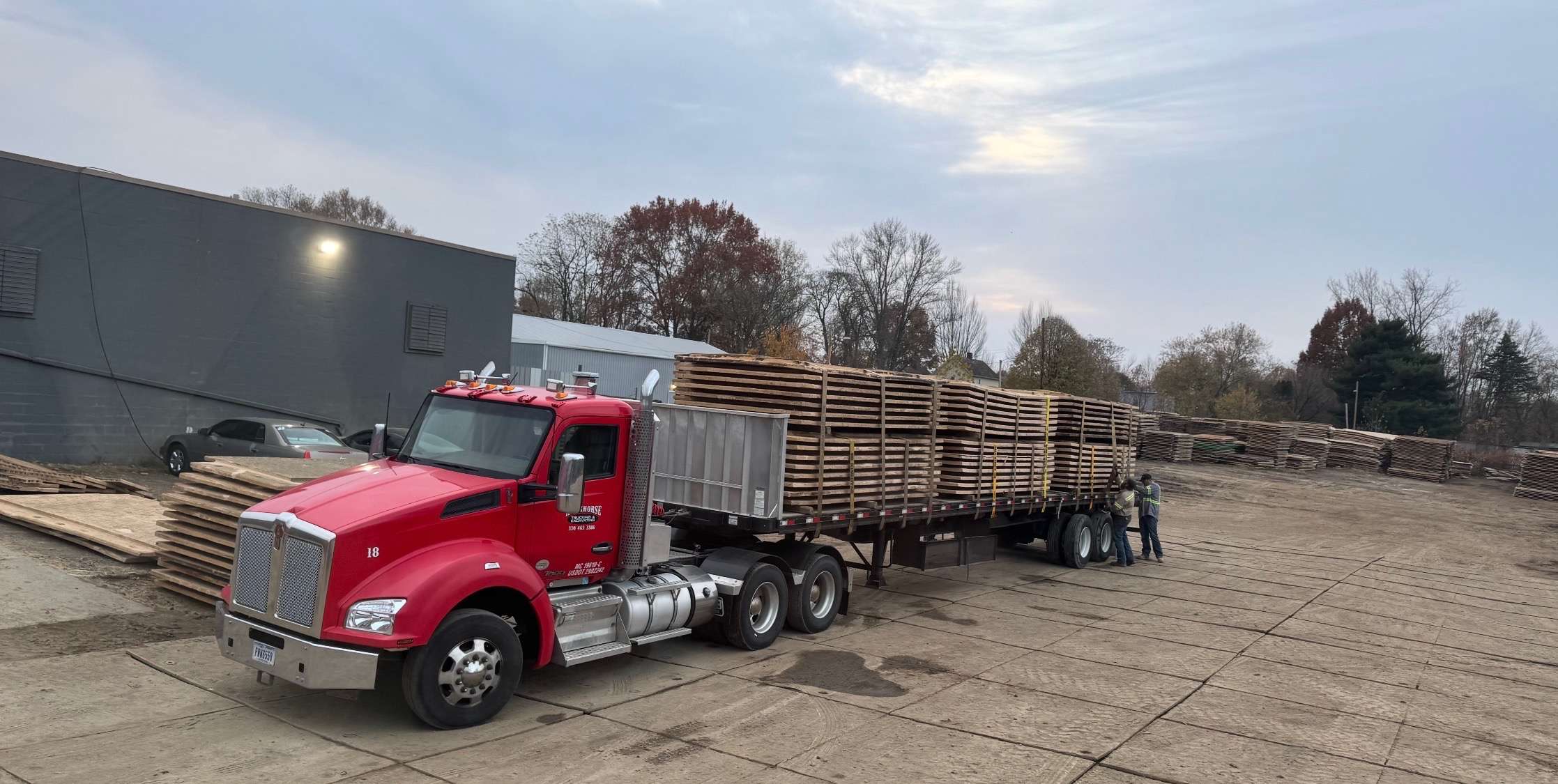MatPRO Kenworth flatbed at Carnegie facility being loaded for delivery